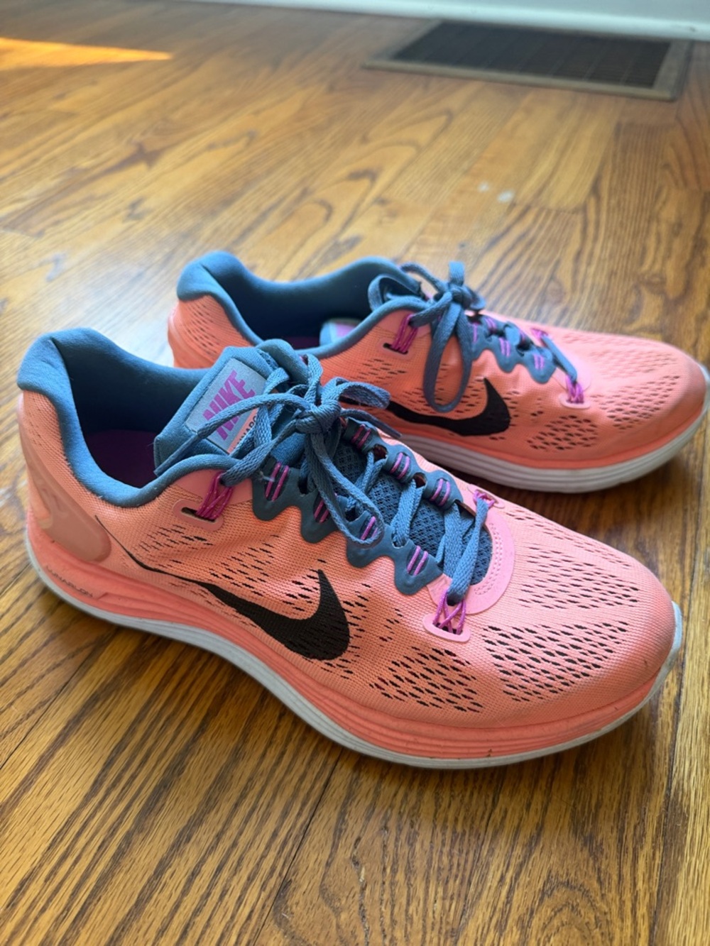 Nike Women's Coral Pink Running Shoes with Black Swoosh